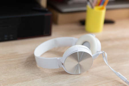 White headphones on the computer table