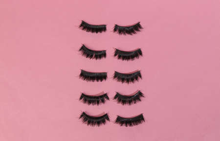 False eyelashes on a pink background. Minimal beauty layoutの写真素材