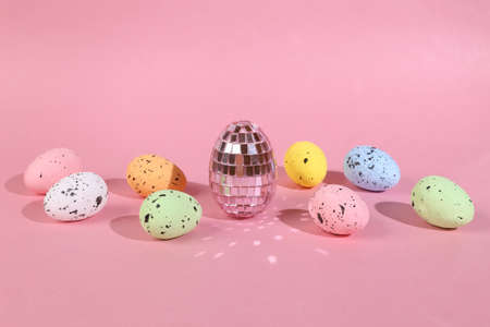 Colored Easter eggs on a pink background. Minimal easter layoutの写真素材