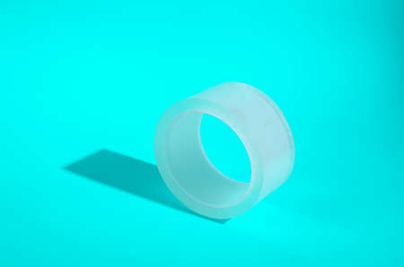 Transparent duct tape skein on turquoise backgroundの写真素材