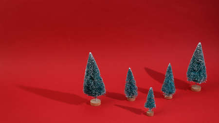 Christmas tree on a red background. Minimal Christmas layoutの写真素材