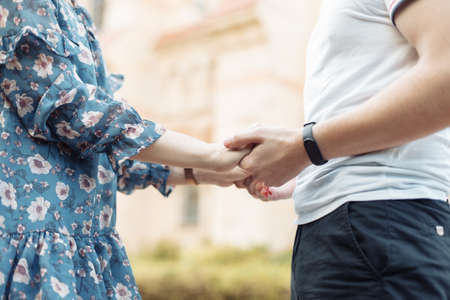 Close-up of a young loving couple holding hands. romantic conceptの写真素材