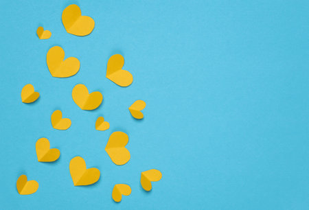 Unity, support for Ukraine in the Russian-Ukrainian war. Yellow hearts on blue background,...