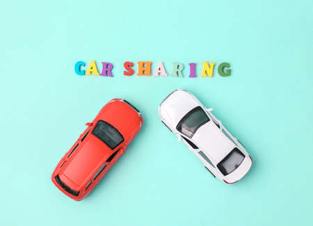 car sharing concept. Two cars on a blue background with the word car sharingの写真素材