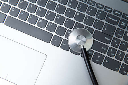 laptop with stethoscope. PC diagnostics