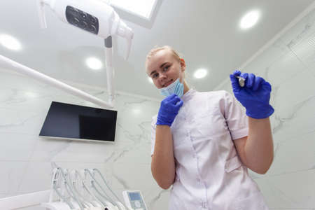 First-person view of a patient, dentist woman in work process. Dentist examination, dental treatment...
