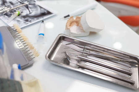 Dentist's workplace. Professional dental instrument on the tableの写真素材