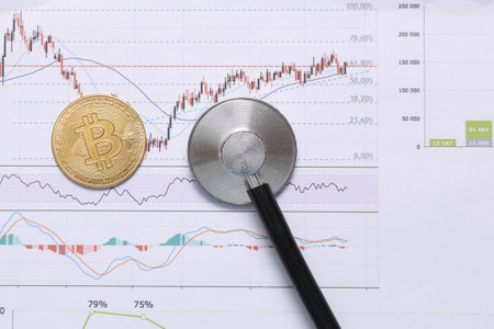 Bitcoin with stethoscope on charts. Financial analytics, cryptocurrency and trading concept