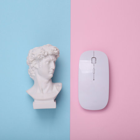 David bust with pc mouse on pink blue background. creative layout. concept pop. Minimal still life. flat lay. top viewの写真素材