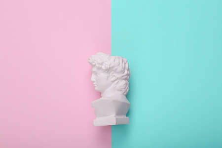 David bust on pink blue background. creative layout. Minimal still life. flat lay. top viewの写真素材