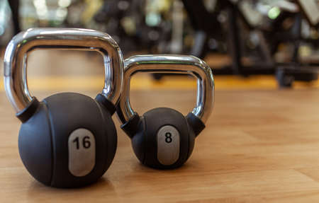 Two heavy kettlebells in the gym. free weight training