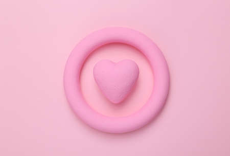 Pink ring with heart on pink background. Minimal still life. flat lay. love concept. Mock upの写真素材