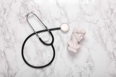 David bust with stethoscope on marble background. top viewの写真素材