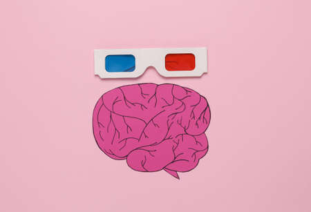 Paper brain with 3d glasses on a pink background