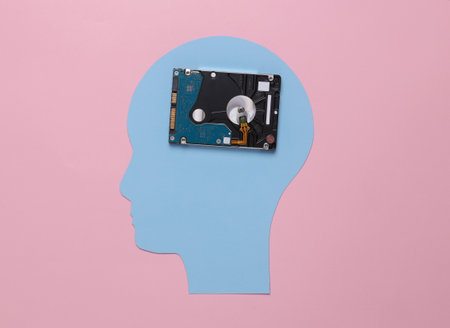 The concept of saving memories. Paper cut head with hard drive on pink background