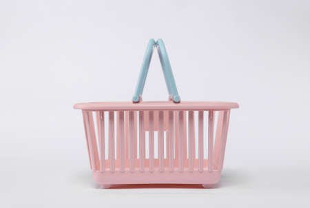 Plastic supermarket basket isolated on white background
