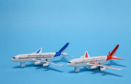 travel concept. Two models of passenger aircraft on a blue backgroundの写真素材