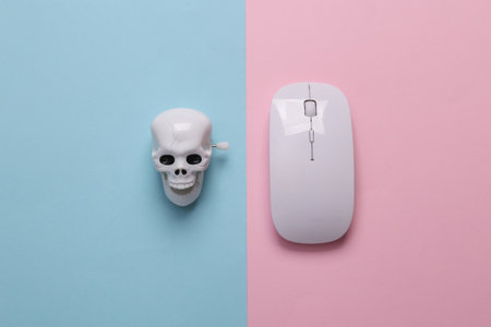 Skeleton skull with pc mouse on blue-pink pastel background. Computer virus, malicious websiteの写真素材