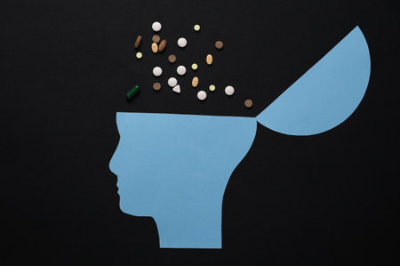 Open your mind, mental health concept, creative thinking. Paper silhouette of human head and pills...