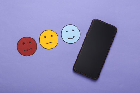 customer satisfaction survey concept. Smartphone, Happy, neutral and sad face paper icon on purple...