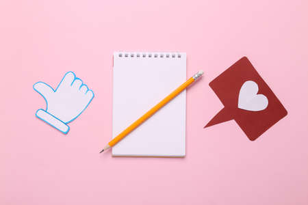 SMM management. Notebook with thumbs up and like notification icons on pink background. Rating,...
