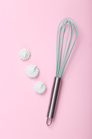 Sweet meringue with whiskey on a pink background. top view. flat layの写真素材