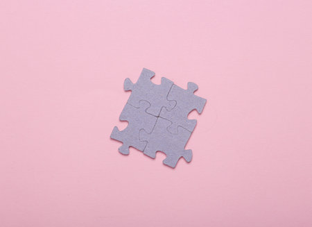 Puzzle pieces on a pink background. top view. Mental health, business, conceptの写真素材
