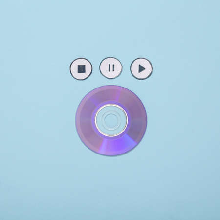 Cd disk with icons start, stop, pause of media player on blue background. top viewの写真素材