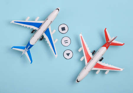 Toy air planes with icons start, stop, pause of media player on blue background. travel concept. top...