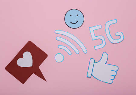 Icons of like, thumbs up, wifi, 5G, happy face on pink background
