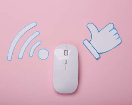 Paper cut Waves wi-fi icon, thumbs up icon and pc mouse on pink background. top view