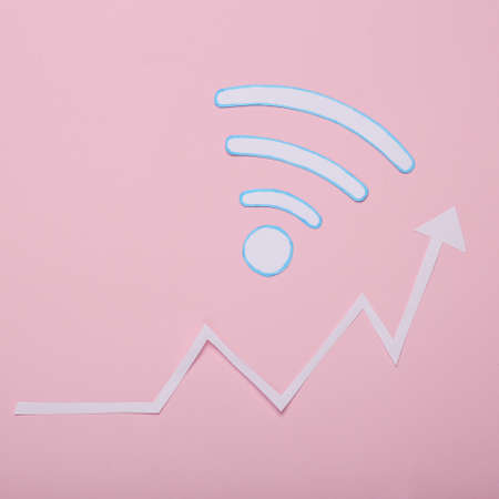 Wifi waves icon with growth arrow on pink backgroundの写真素材