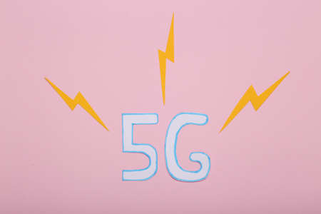 Paper cut 5G with sparks on pink backgroundの写真素材