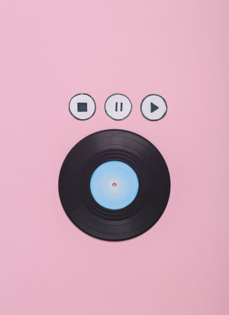 Vinyl record plate with icons start, stop, pause of media player on pink background. top viewの写真素材
