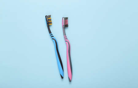 Two toothbrushes on a blue background. top viewの写真素材