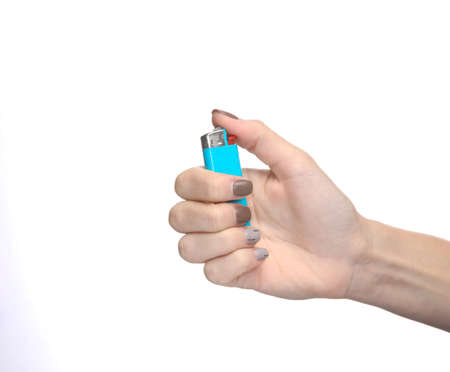 Female hand holding a lighter isolated on white background