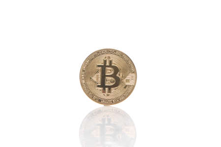 Gold bitcoin coin isolated on white background with reflectionの写真素材