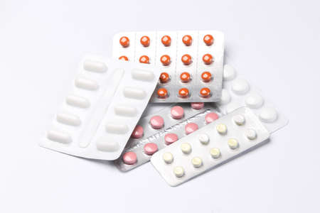 Different blisters of pills isolated on white background
