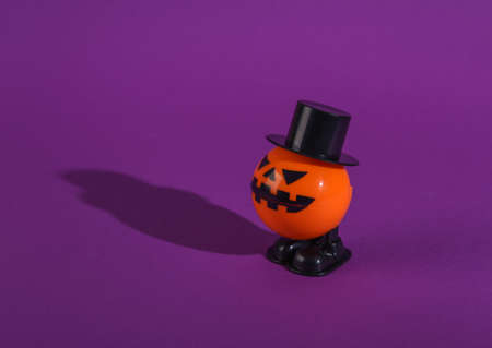Clockwork halloween toy monster on purple backgroundの写真素材