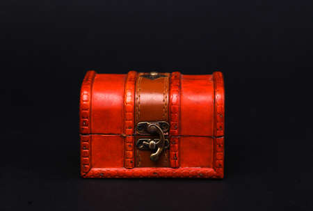 Red Pirate chest isolated on black backgroundの写真素材