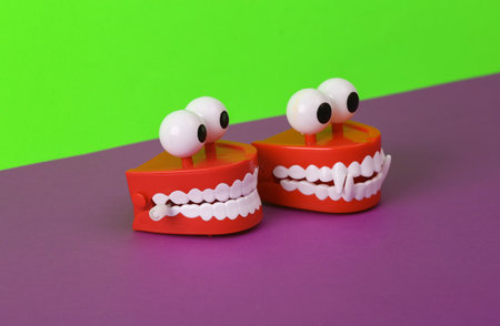 Monster clockwork jaws on green purple backgroundの写真素材