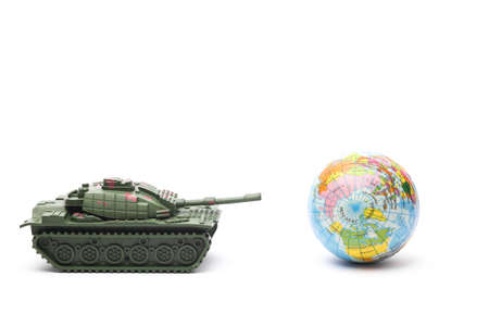 Toy tank with globe on white background. world warの写真素材
