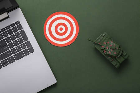 Tank with pc mouse and target on green background. Antivirus, system protection. top viewの写真素材