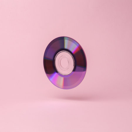 CÐ disk flying in antigravity on pink background with shadow. Levitation object in the air. Creative minimal layoutの写真素材