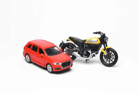 Motorcycle and car model isolated on white background