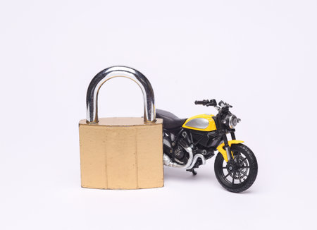 Motorcycle model with lock isolated on white background. Insurance or loss of driver's license conceptの写真素材