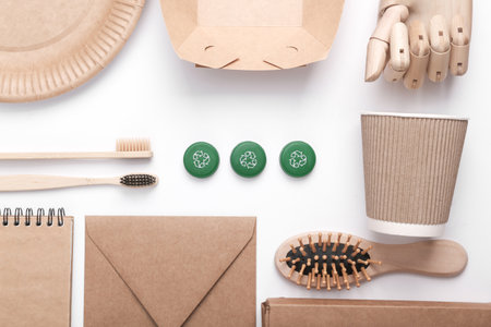 Plastic bottle caps with circular recycling symbol and eco things on white background. Round...