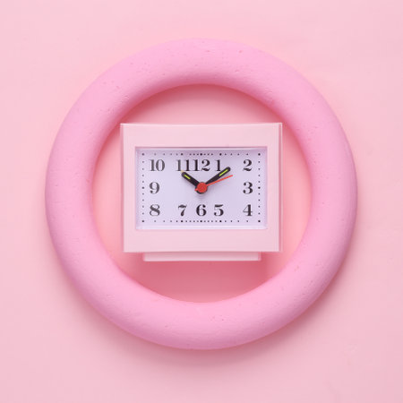 Pink square table clock round on pink pastel background