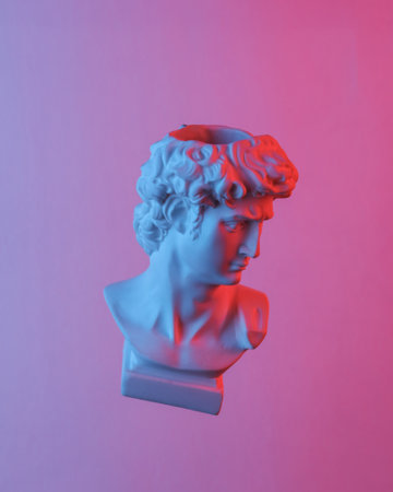David bust floating in the air, isolated in blue-red neon gradient light. levitating objects. Minimal conceptの写真素材