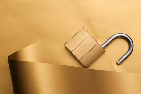 Lock on a luxurious golden backgroundの写真素材